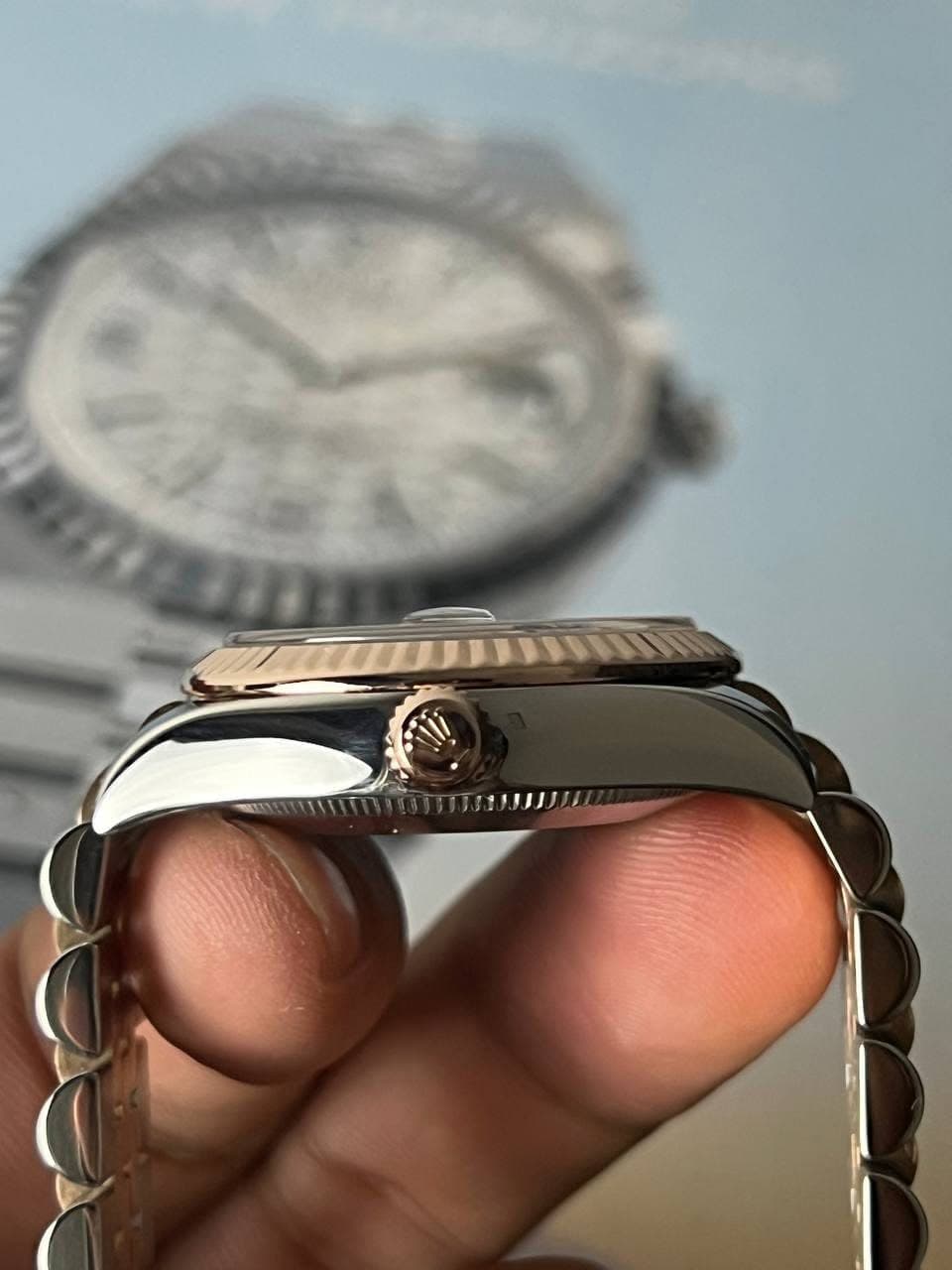 May be an image of wrist watch and text