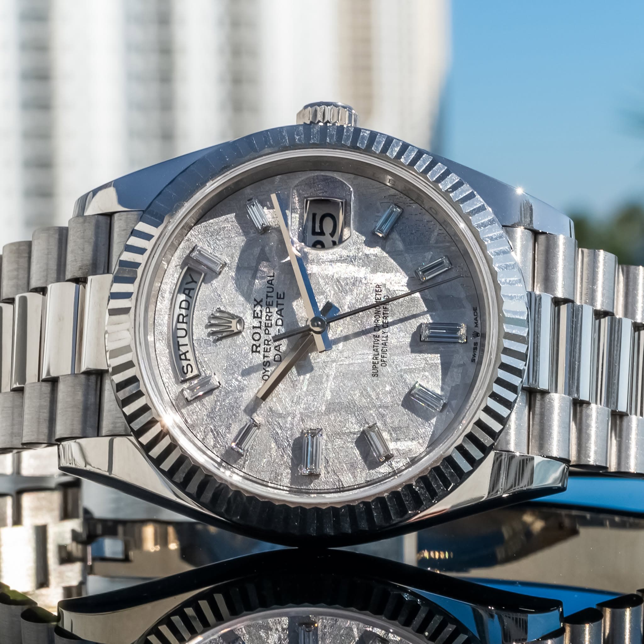 May be an image of wrist watch and text