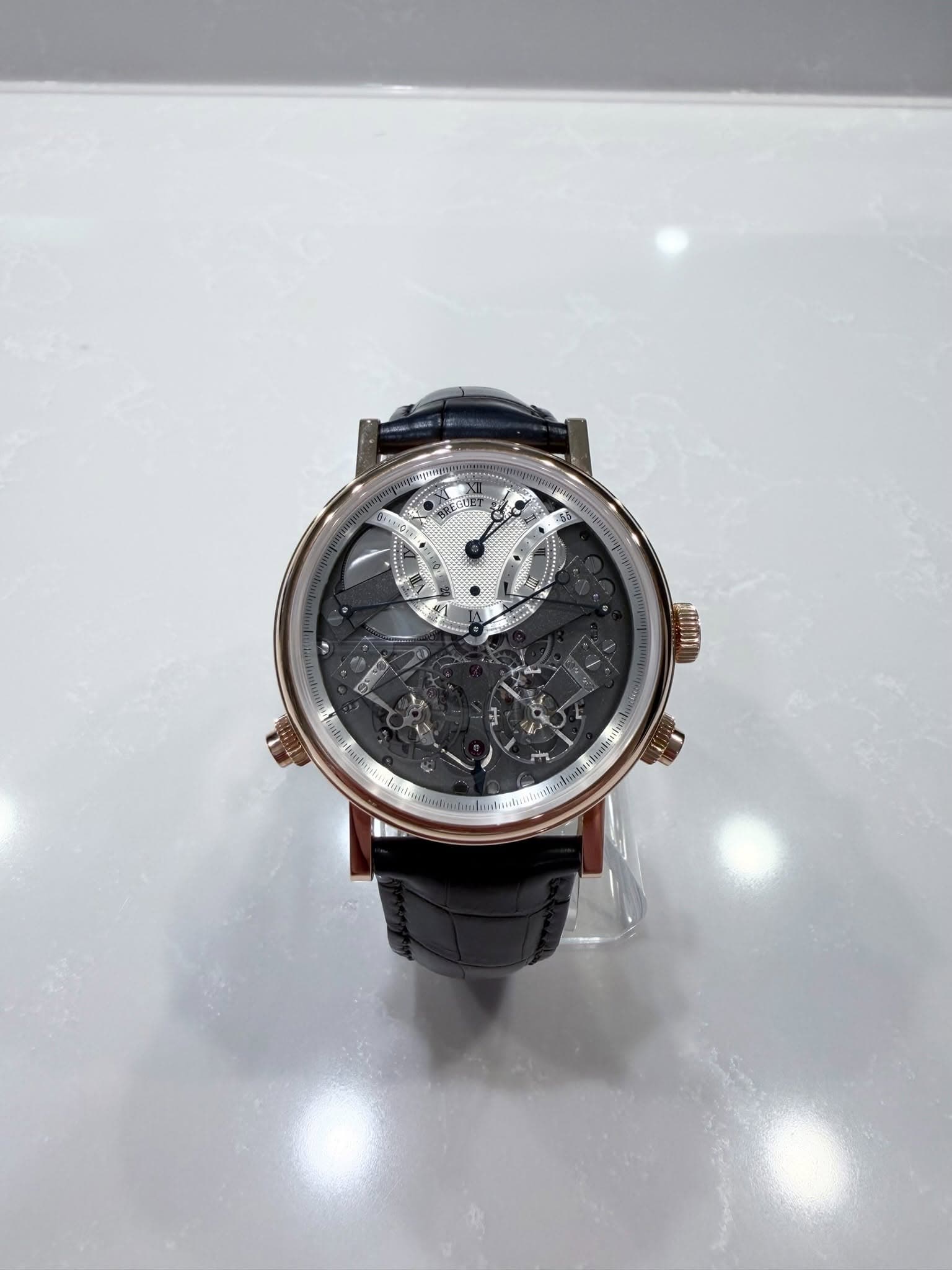 May be an image of wrist watch and text