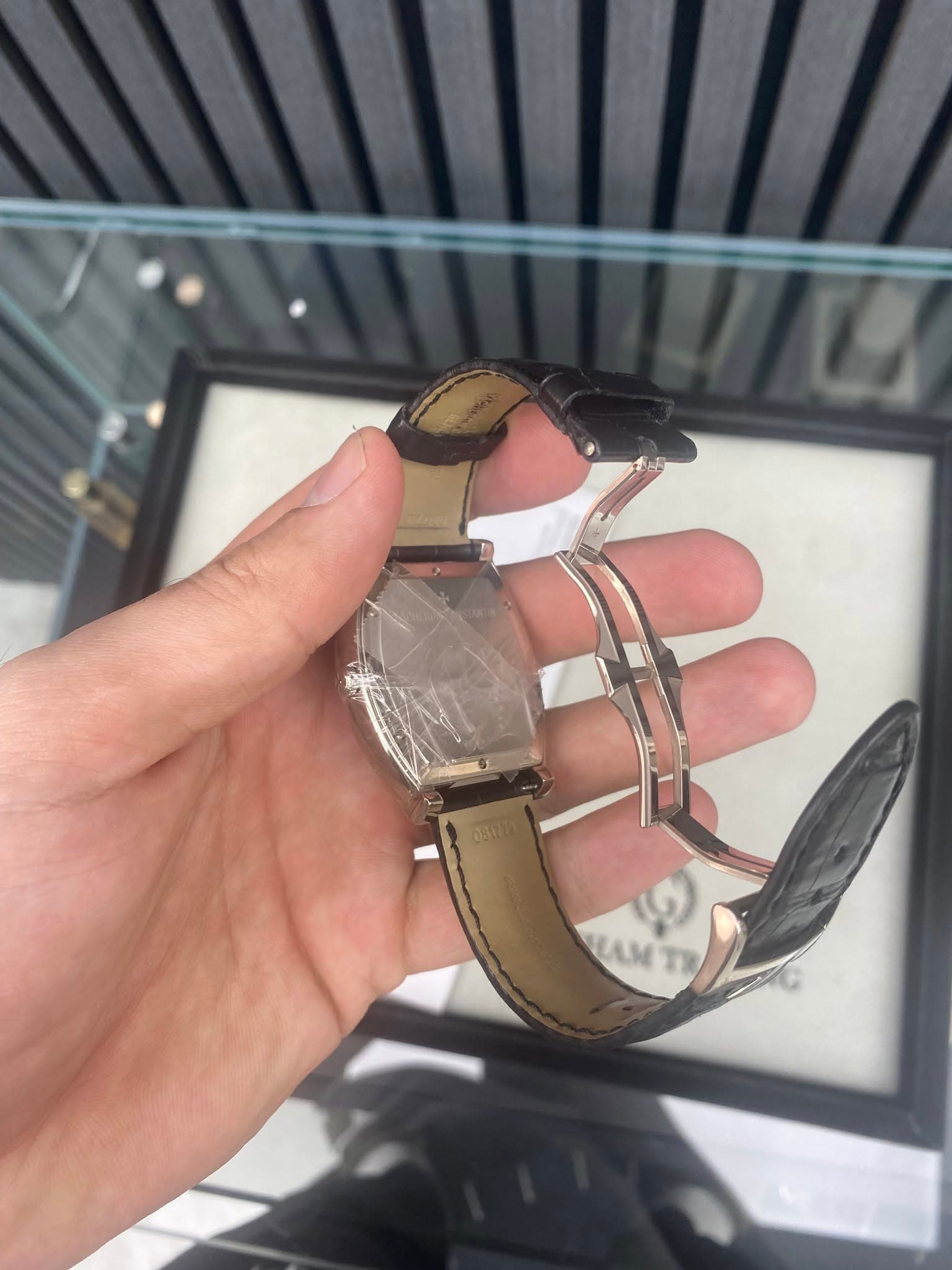 May be an image of wrist watch and text