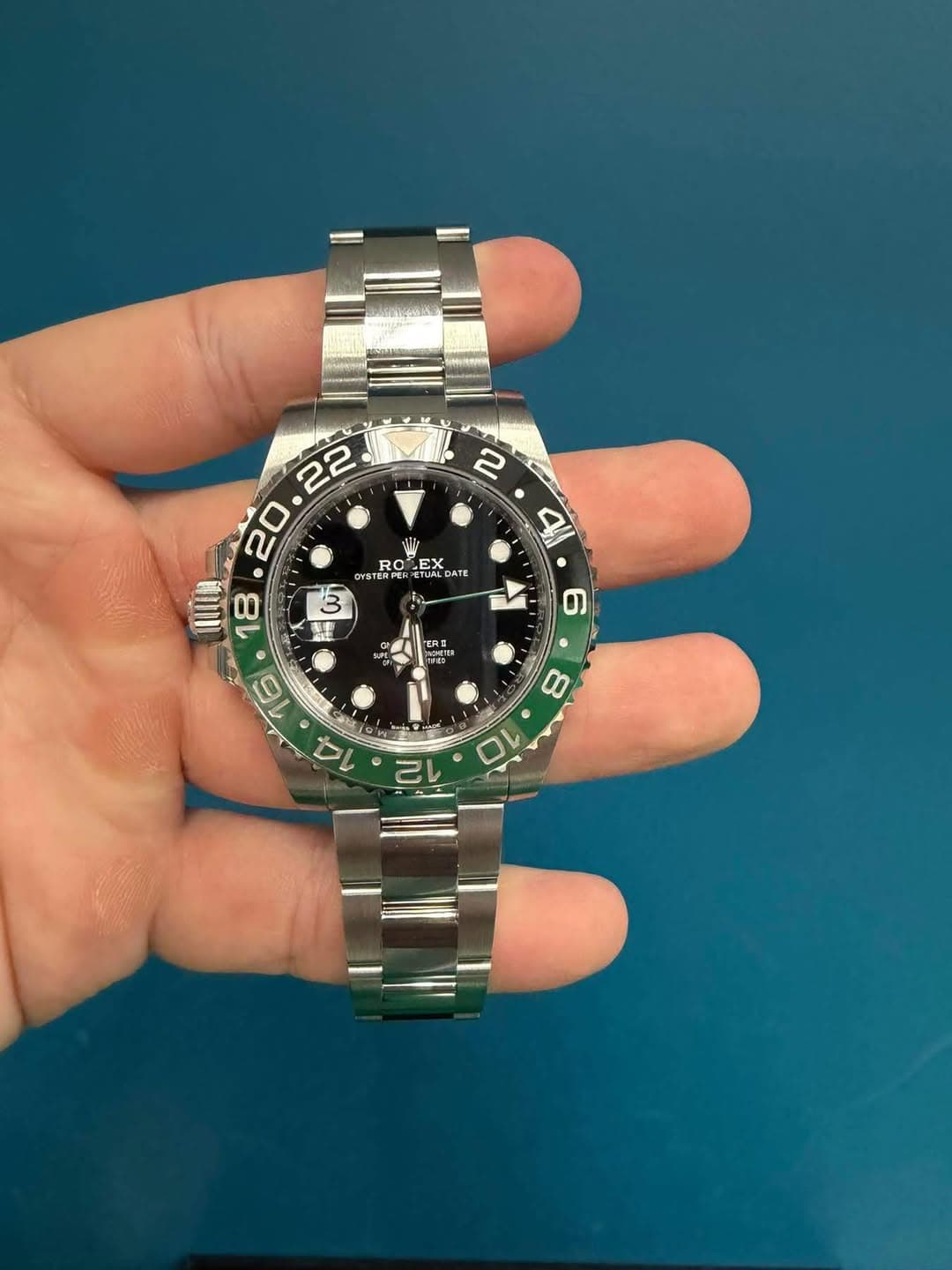 May be an image of wrist watch and text