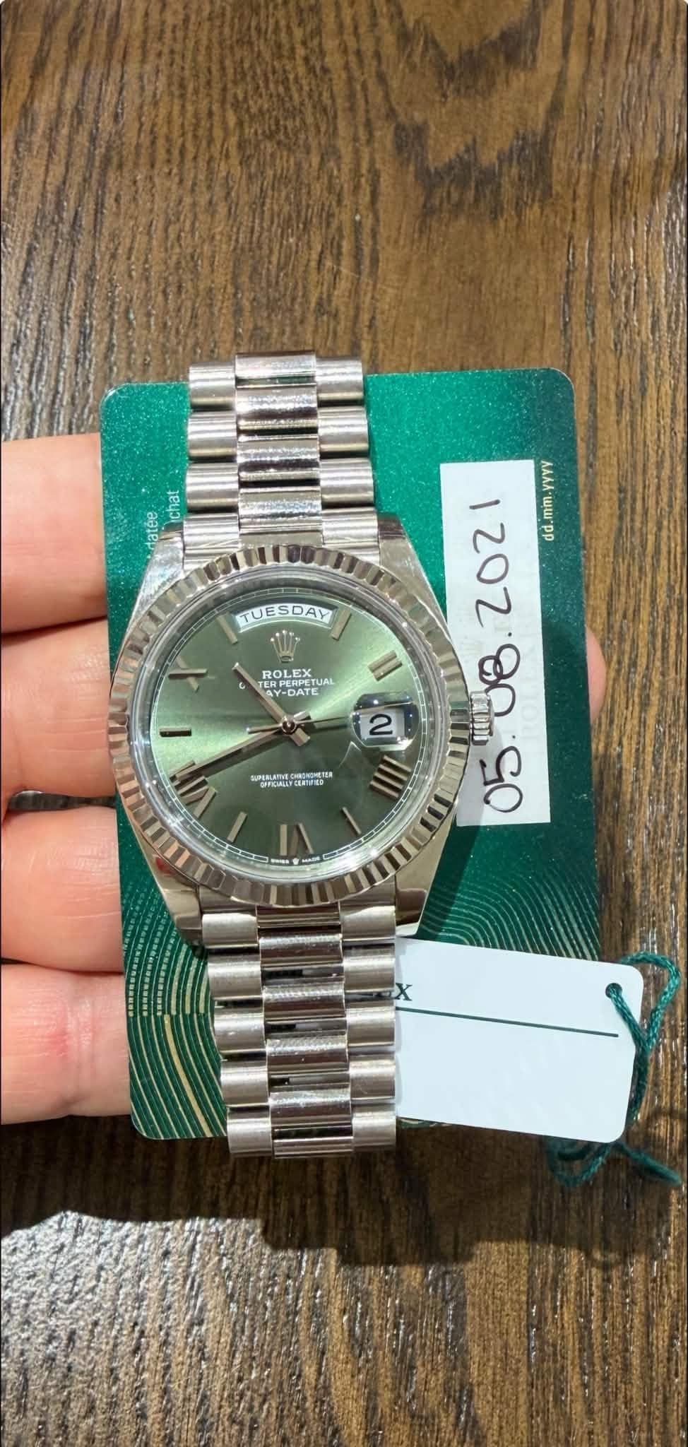 May be an image of wrist watch and text