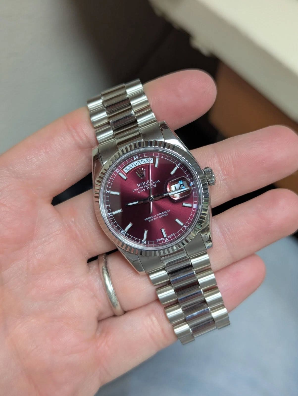 May be an image of wrist watch and text