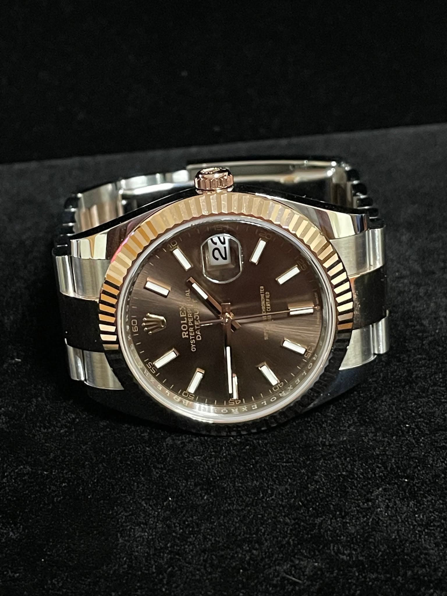 May be an image of wrist watch and text