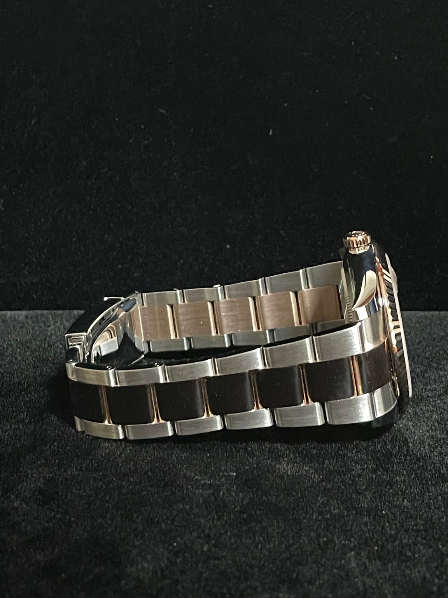 May be an image of jewelry and wrist watch