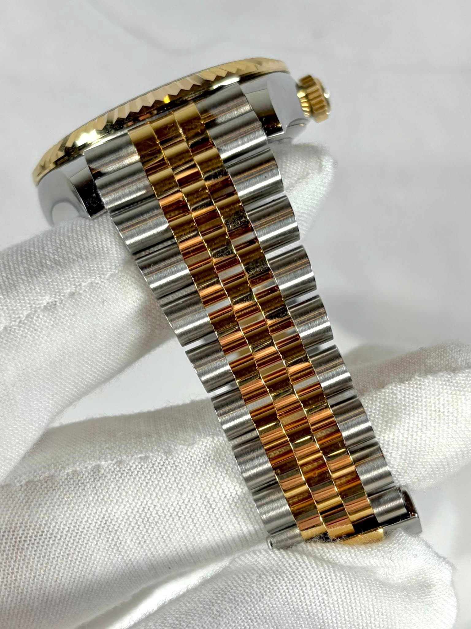 May be an image of wrist watch and text