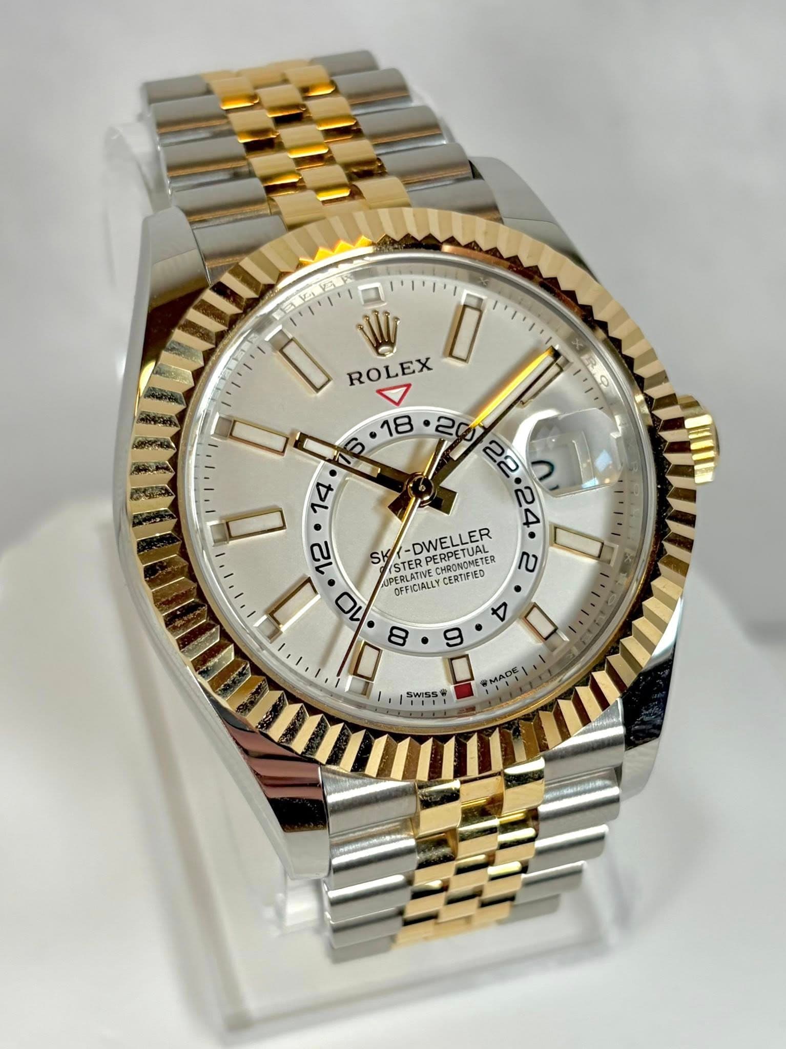 May be an image of wrist watch and text that says '2E D ROLEX AC ነ 6 ·18 • . ٨ 22 24 12 SK STER DWELLER PERPETUAL PERPETUAL CHRONOMETER NAMETE I IE UPERLATIV PERLATVE ERLATRE 10…
