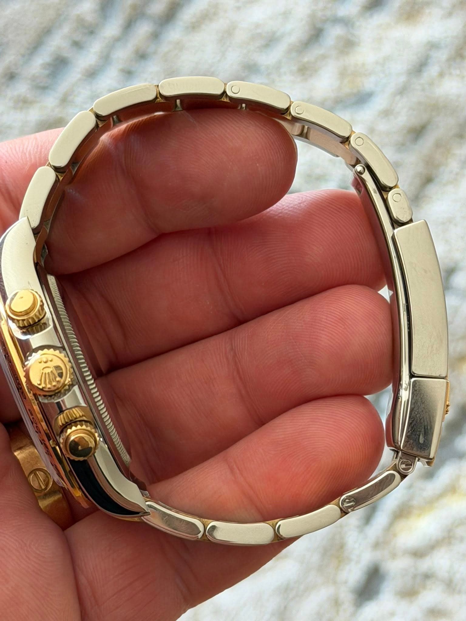May be an image of wrist watch and jewelry