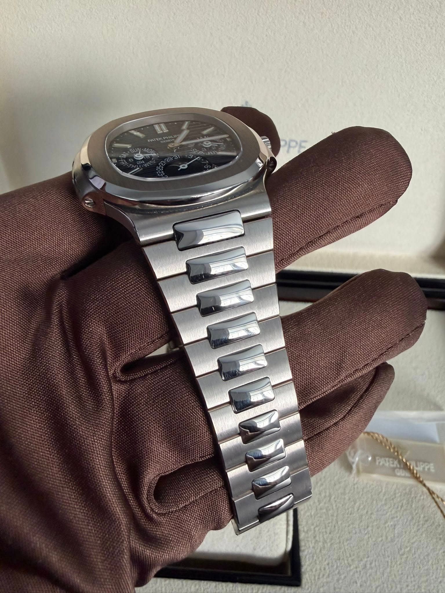 May be an image of wrist watch and text