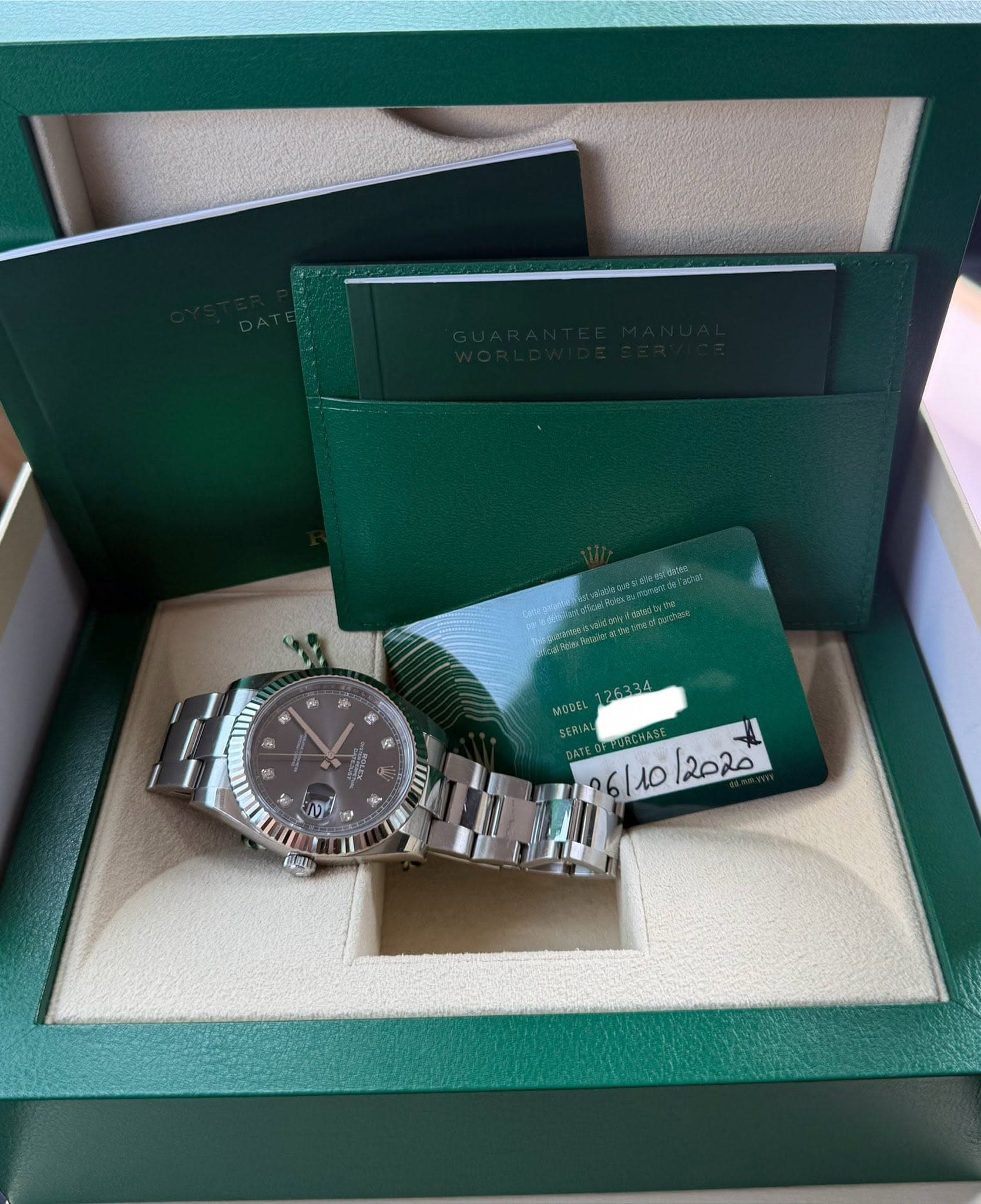 May be an image of wrist watch and text