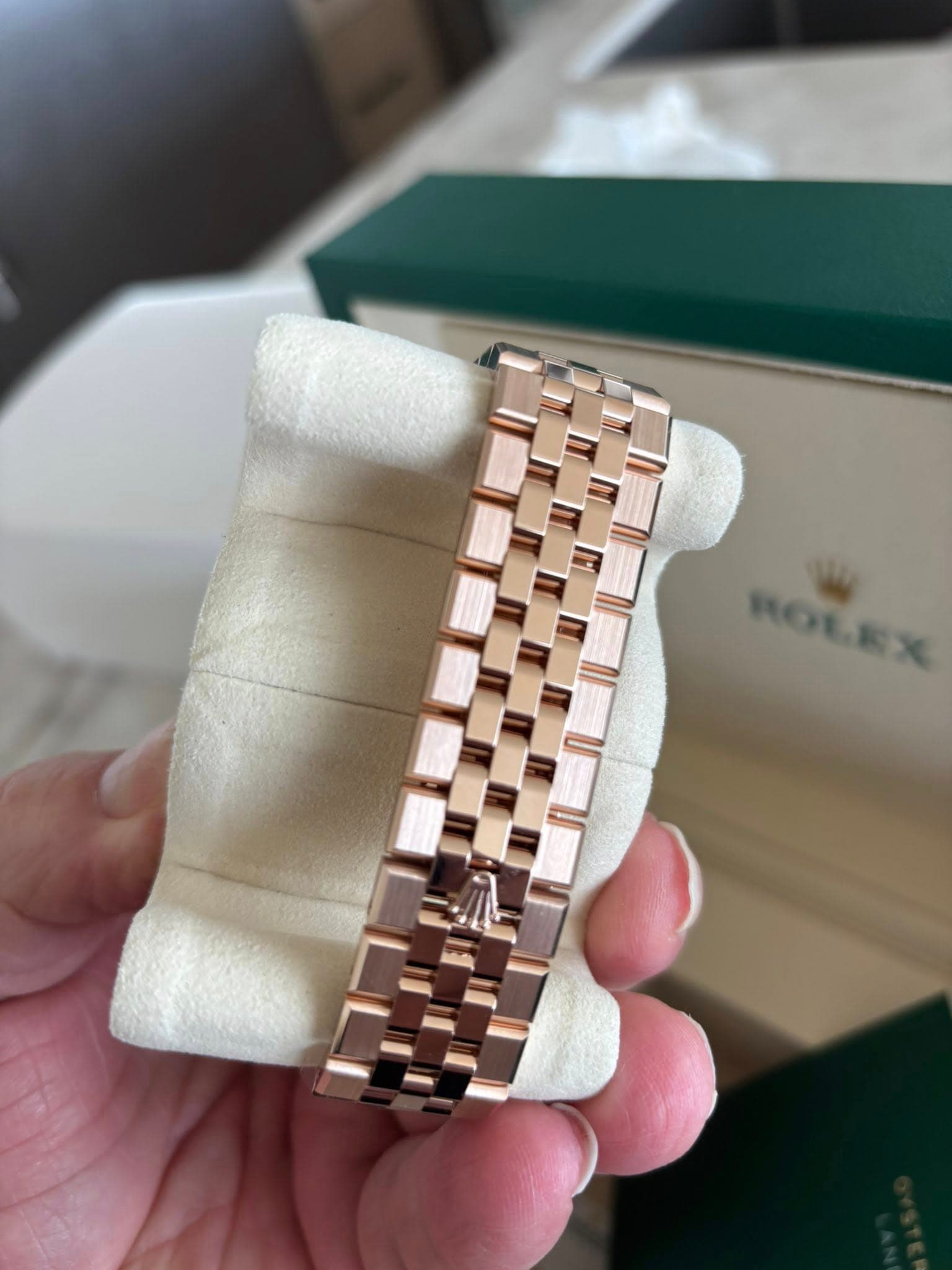 May be an image of wrist watch and text