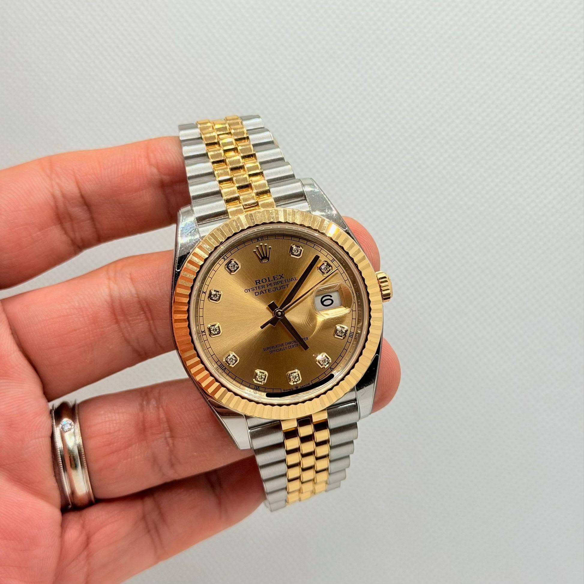 May be an image of wrist watch and text