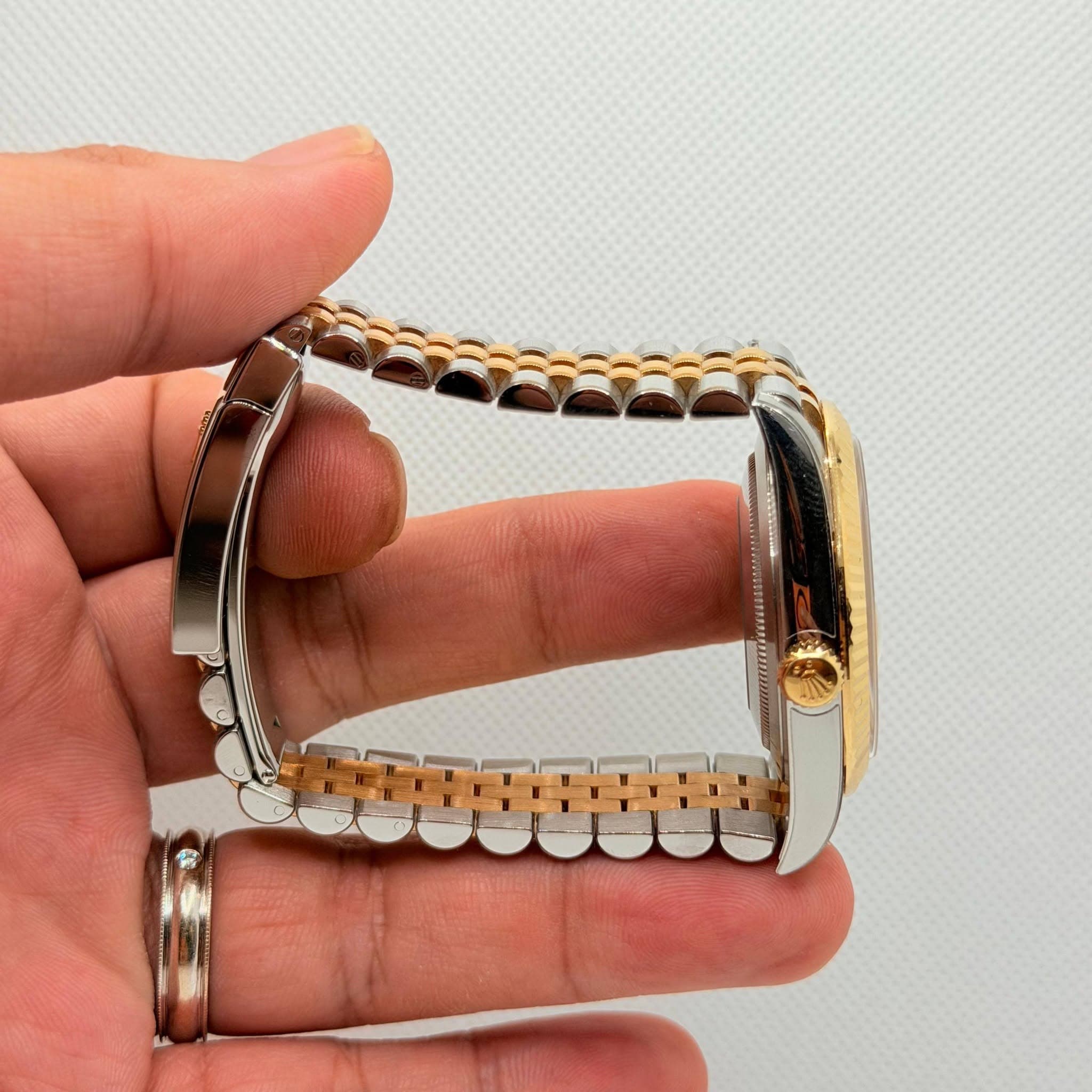 May be an image of jewelry and wrist watch