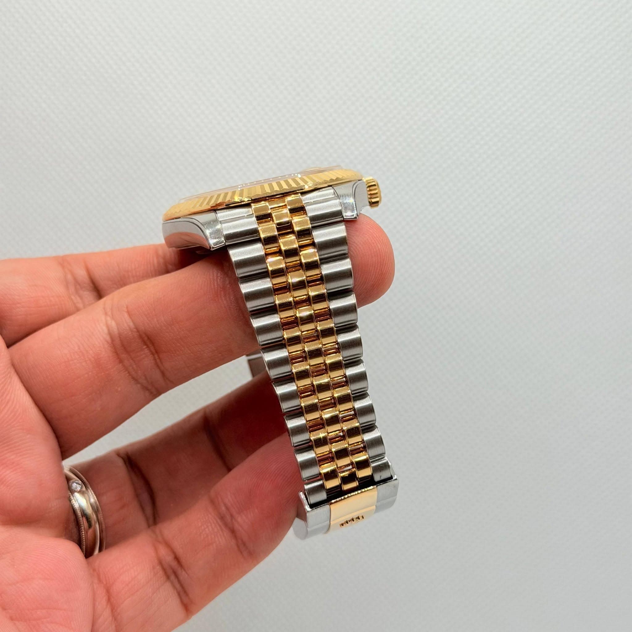 May be an image of digital watch and text