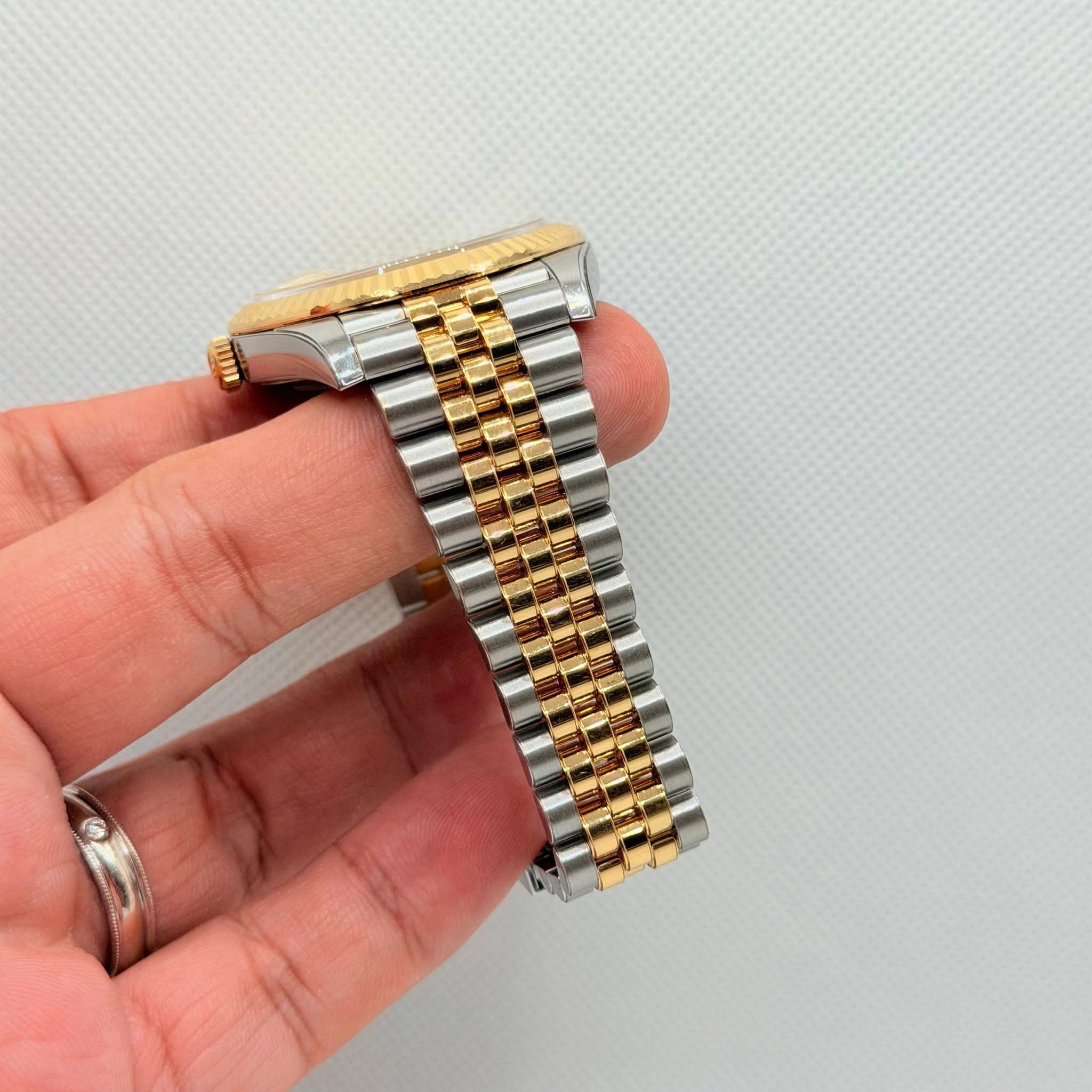 May be an image of wrist watch
