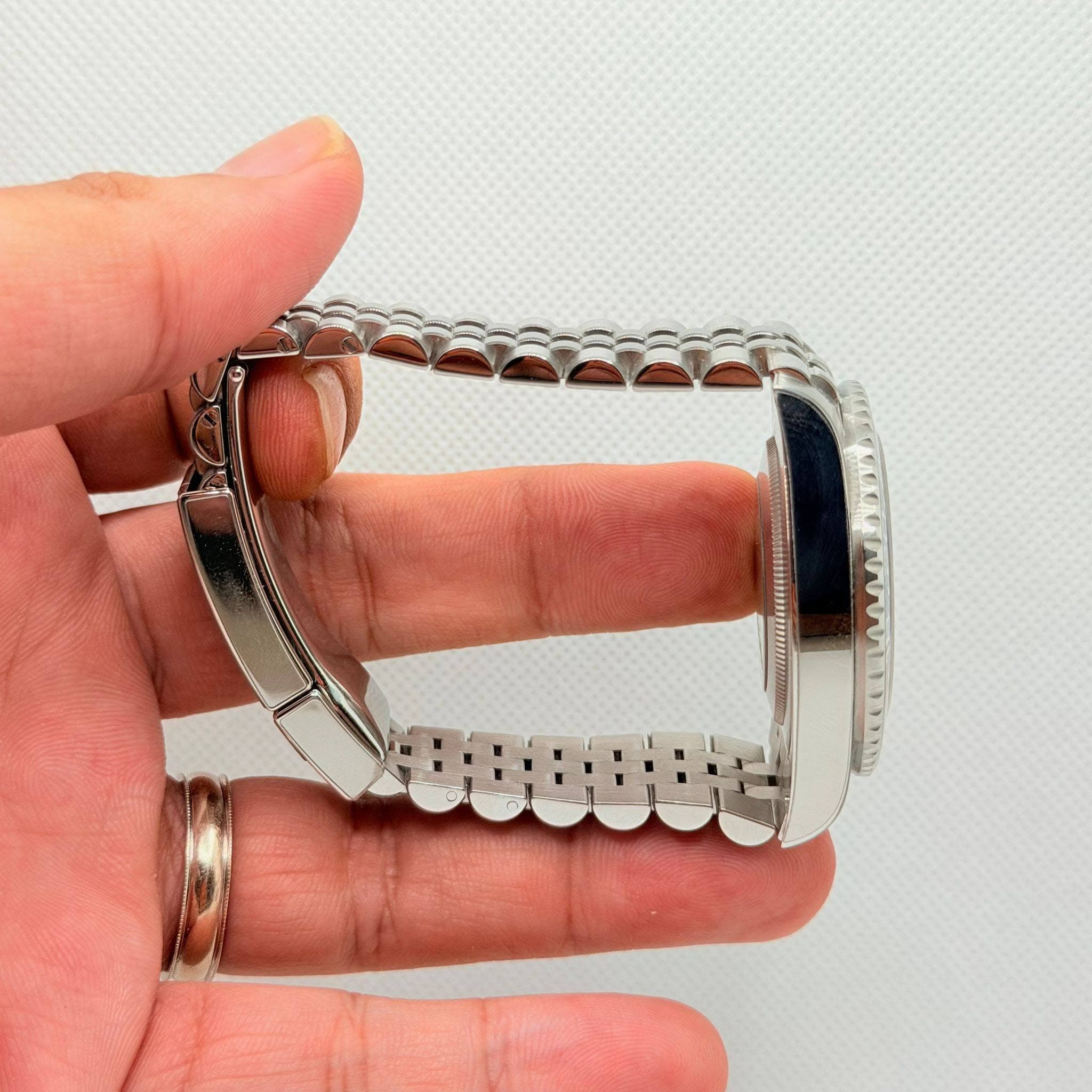 May be an image of wrist watch and jewelry