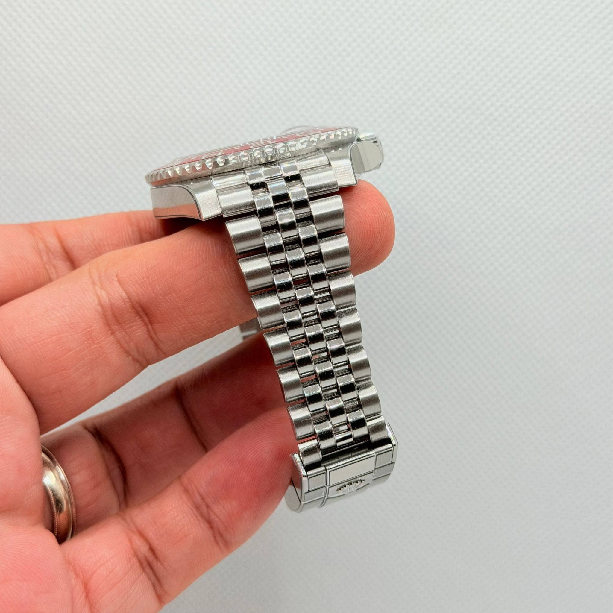 May be an image of wrist watch and text