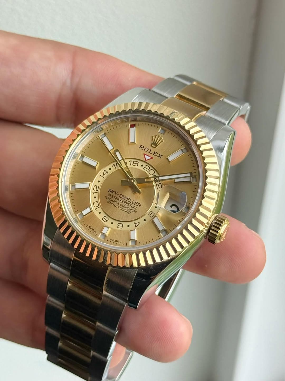 May be an image of wrist watch and text