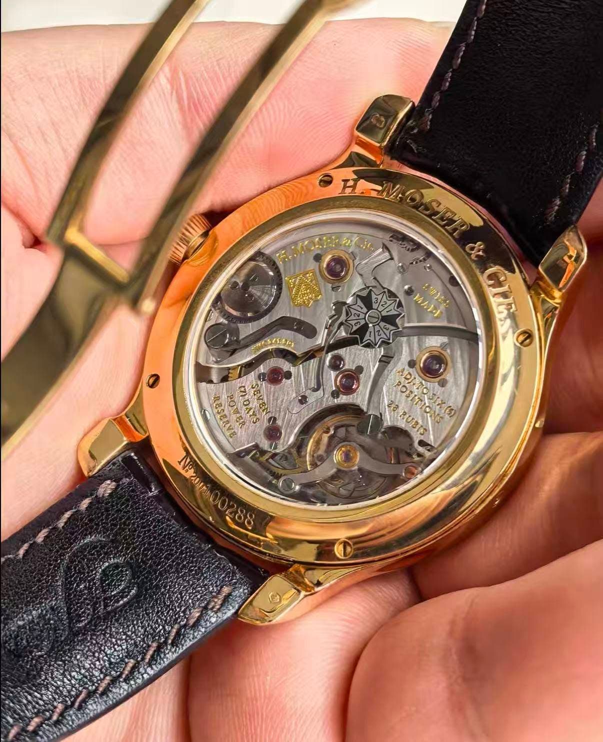 May be an image of wrist watch and text