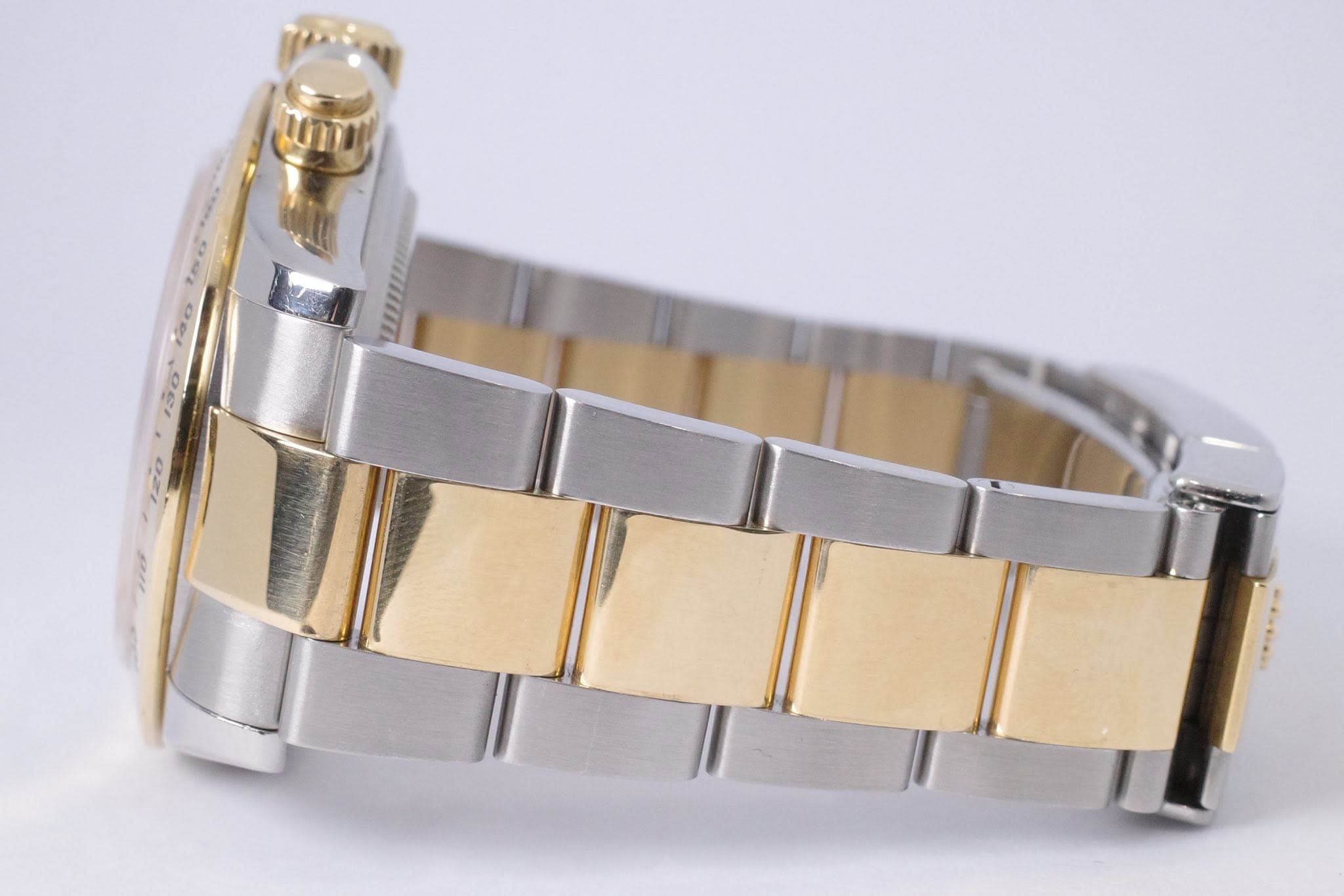 May be an image of jewelry, wrist watch and text