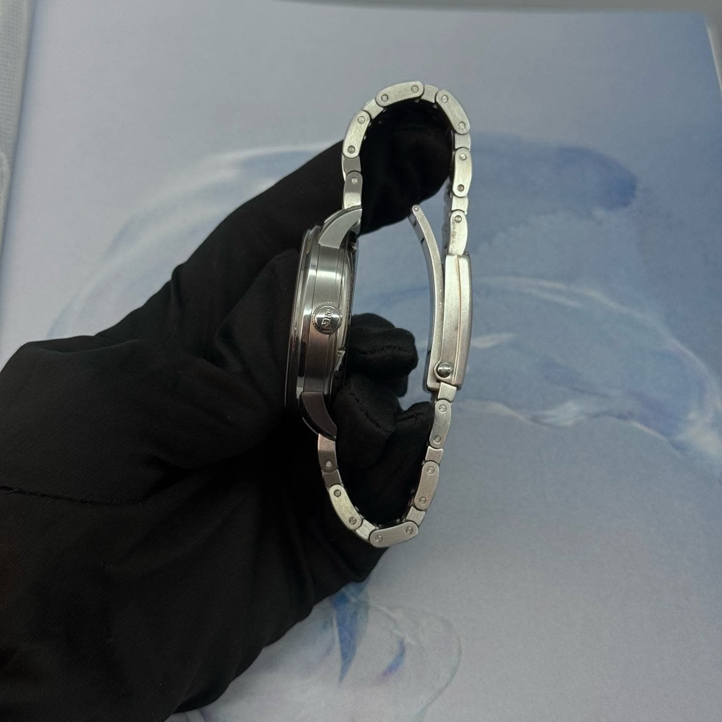 May be an image of wrist watch and ring