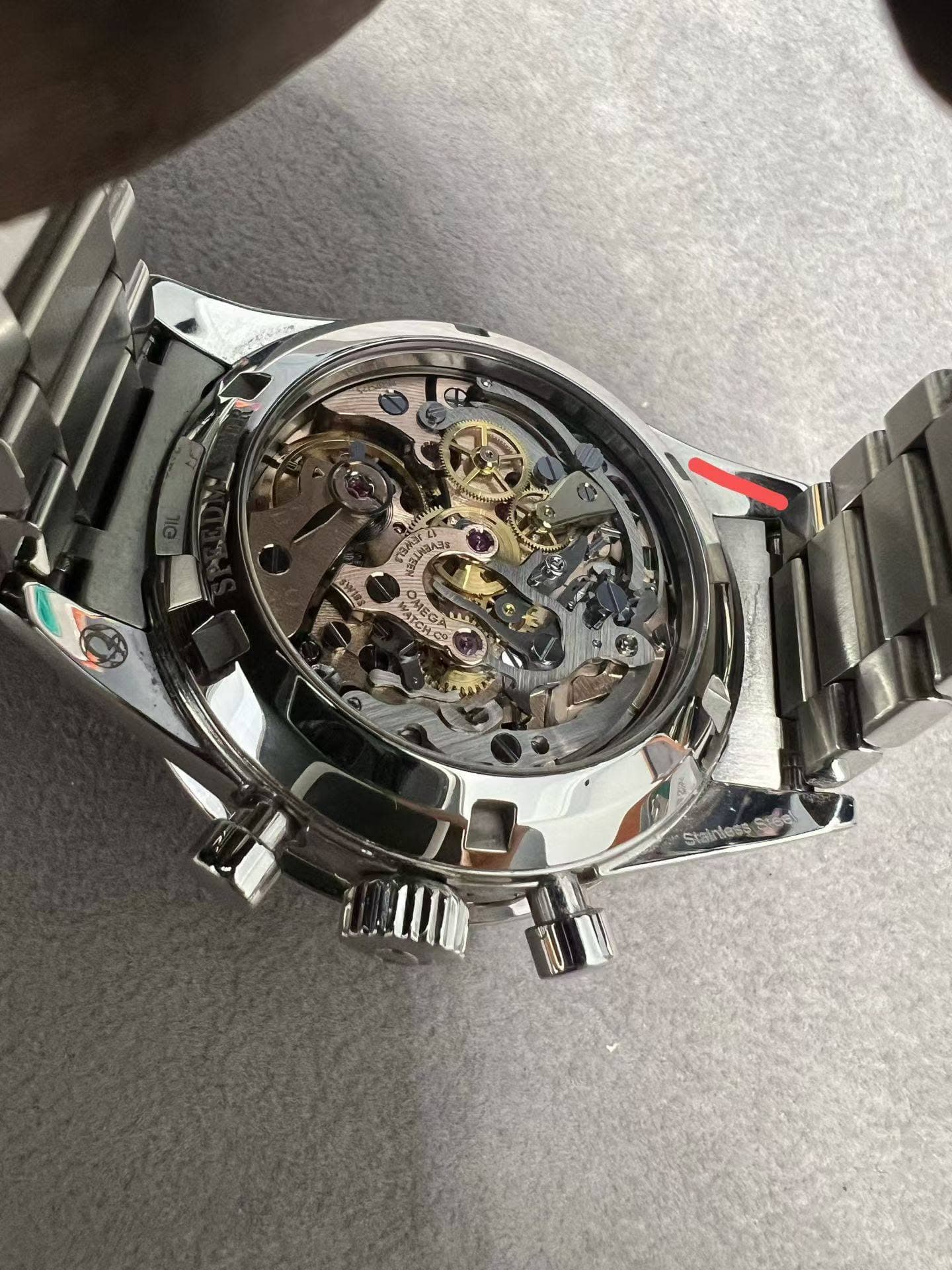 May be an image of wrist watch and text