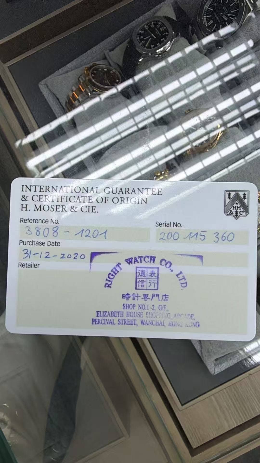 May be an image of jewelry, wrist watch, ticket stub and text that says 'INTERNATIONAL GUARANTEE & CERTIFICATE OF ORIGIN H. MOSER & CIE. Reference No. イ Purchase Date Retailer…