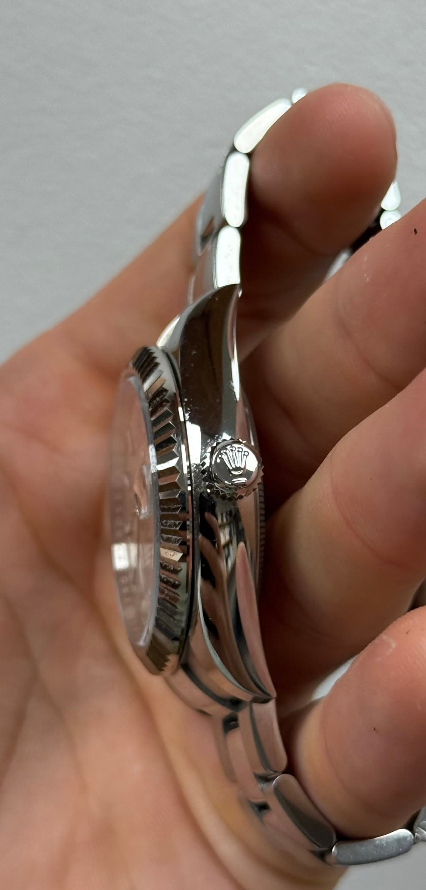 May be an image of wrist watch and jewelry