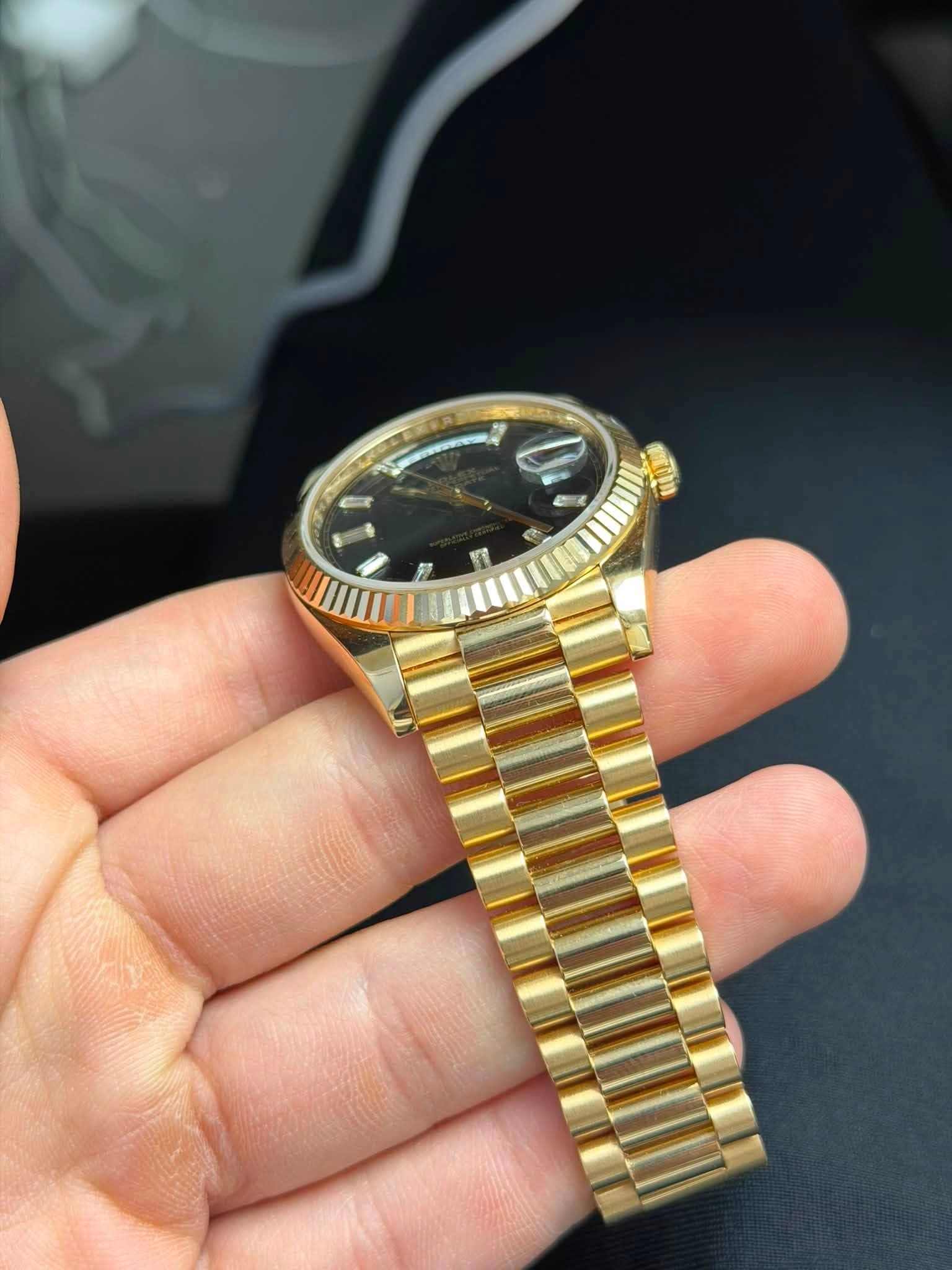 May be an image of wrist watch and text