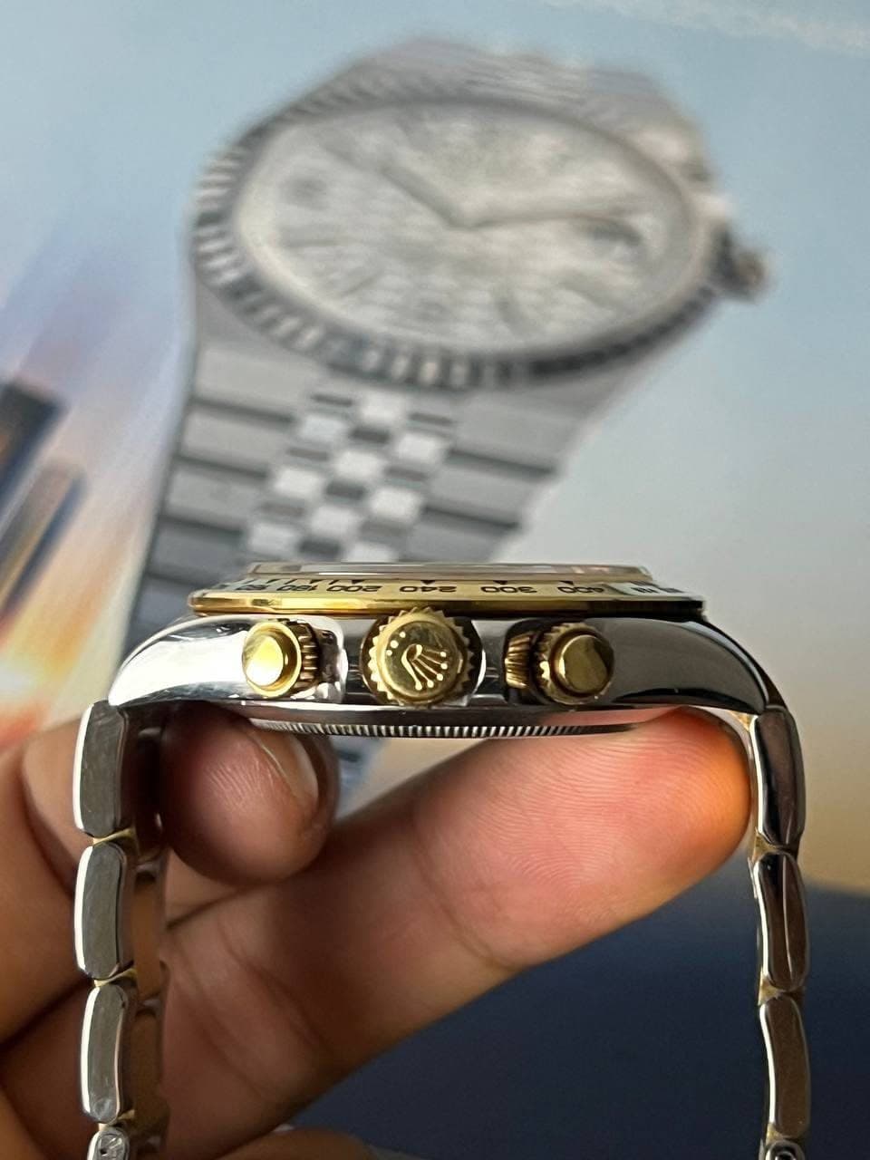 May be an image of wrist watch and text