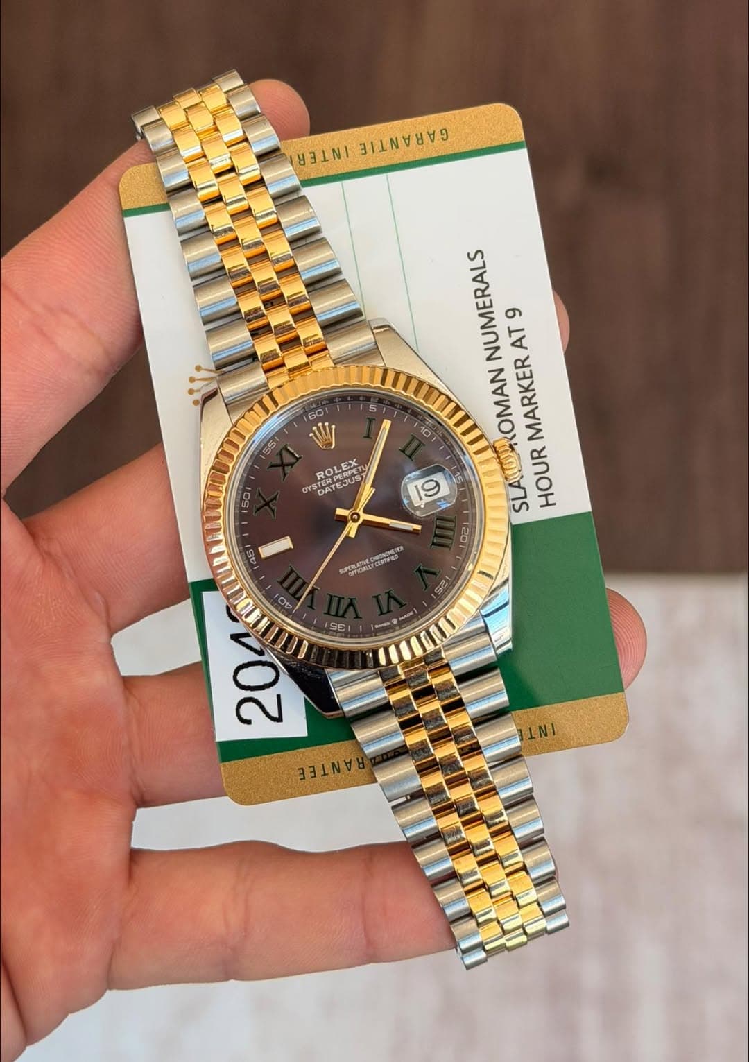 May be an image of wrist watch and text
