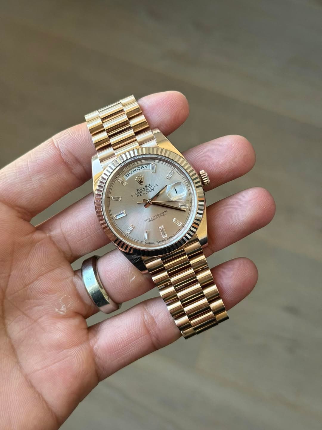 May be an image of wrist watch and text