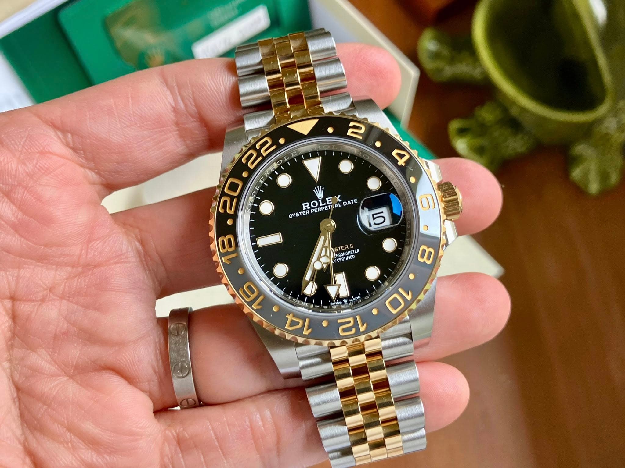 May be an image of wrist watch and text