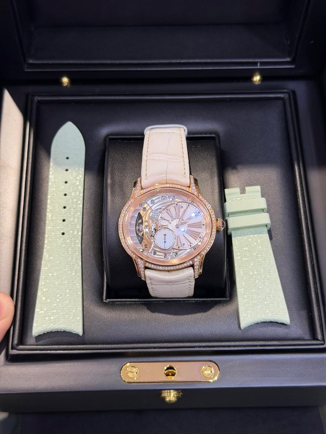 May be an image of wrist watch and text