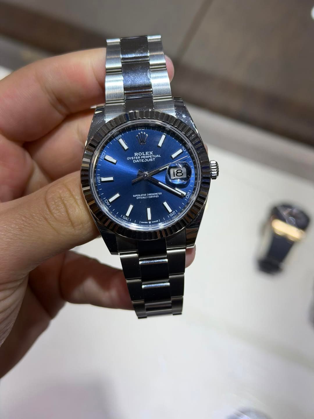 May be an image of wrist watch and text