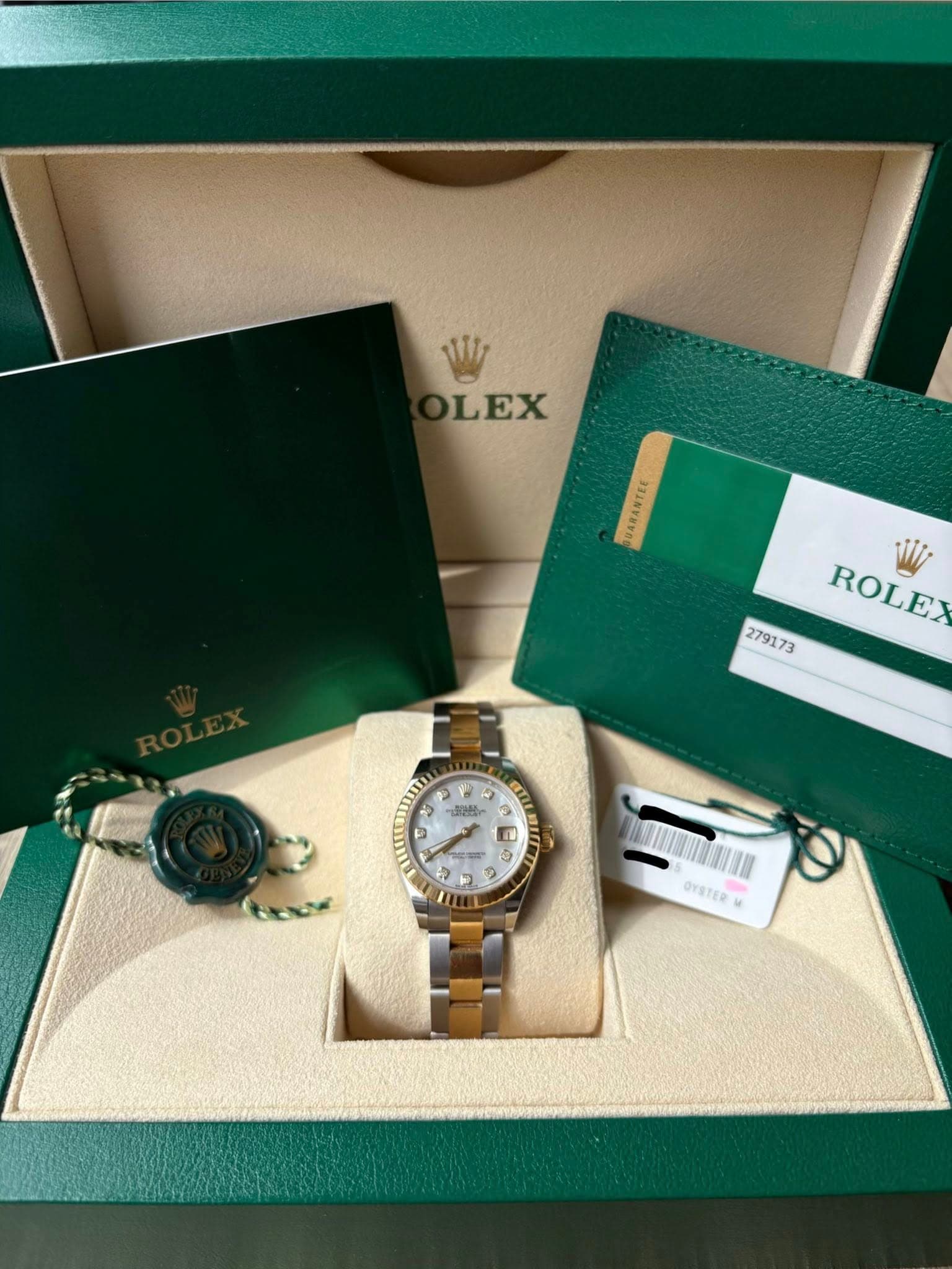 May be an image of wrist watch and text