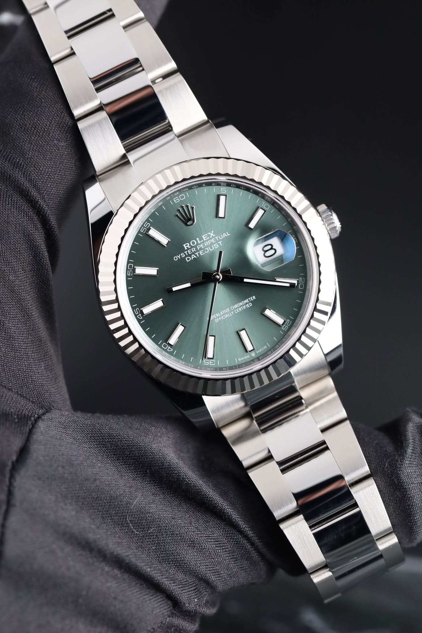 May be an image of wrist watch and text