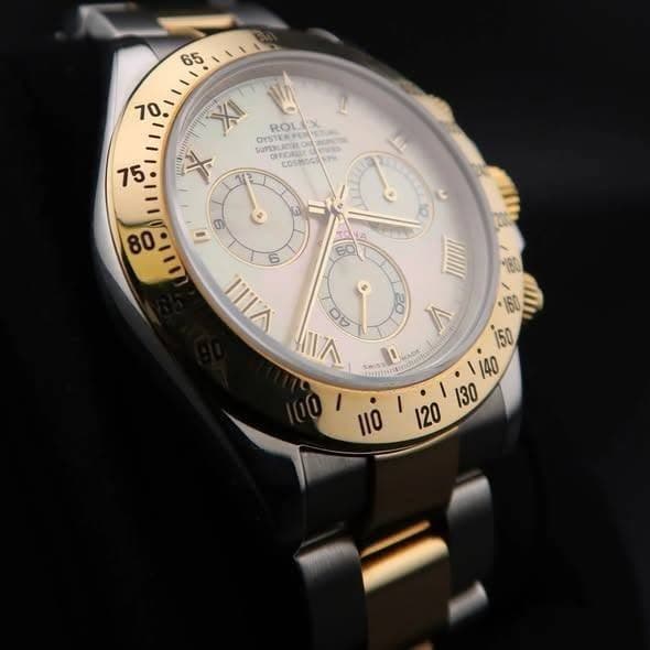 May be an image of wrist watch and text