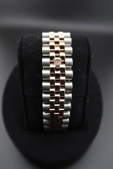 May be an image of wrist watch and jewelry