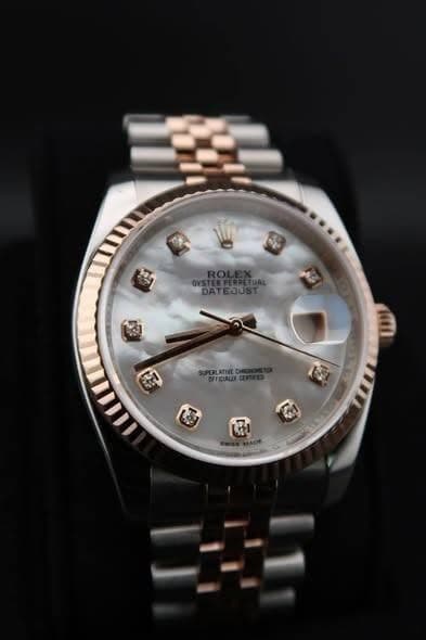 May be an image of wrist watch and text