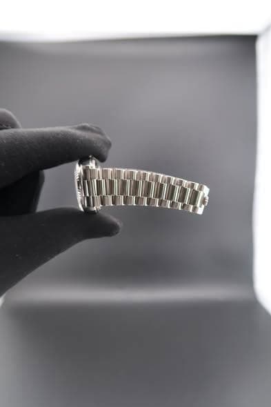 May be an image of wrist watch and jewelry