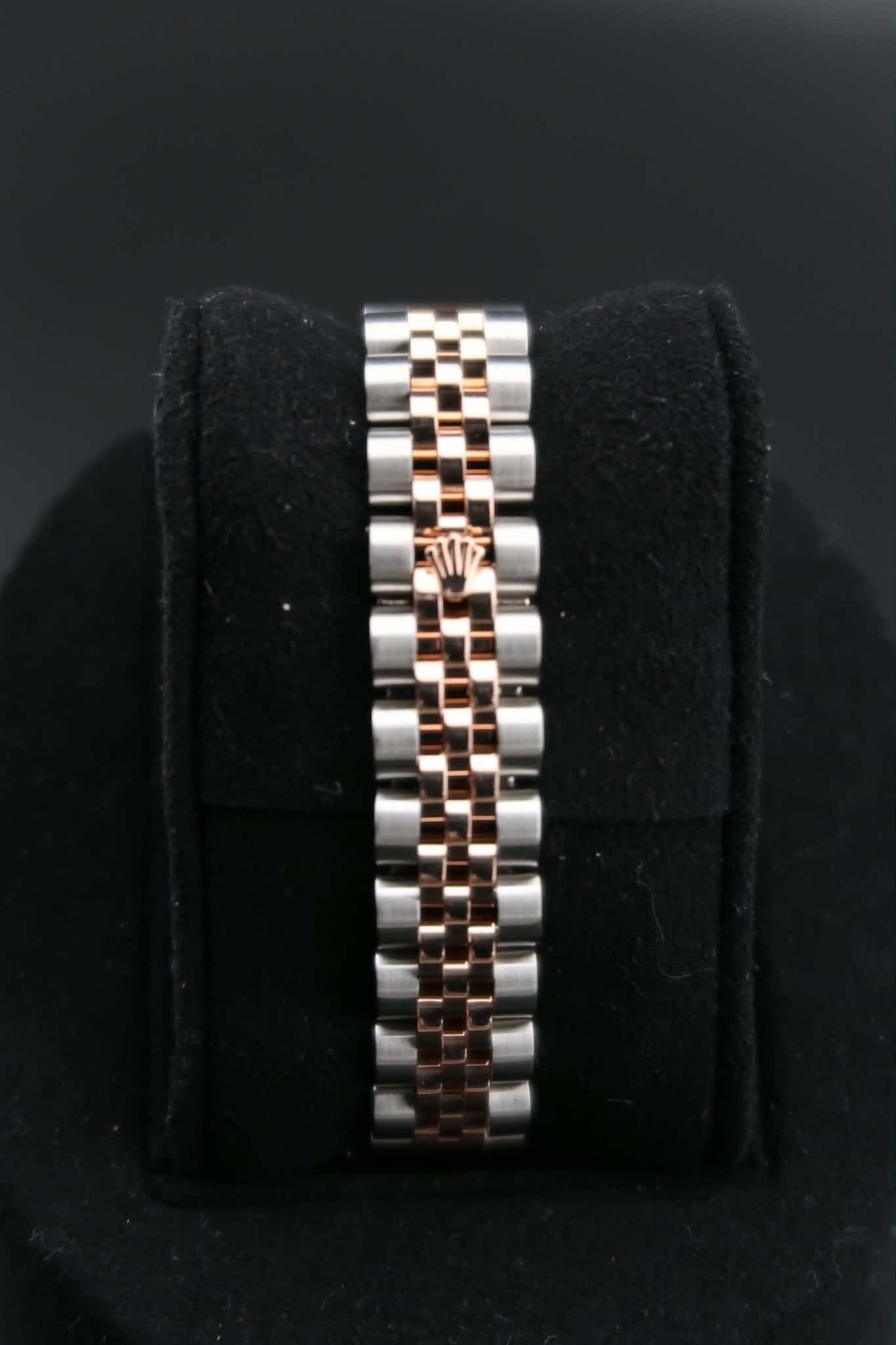 May be an image of jewelry and wrist watch
