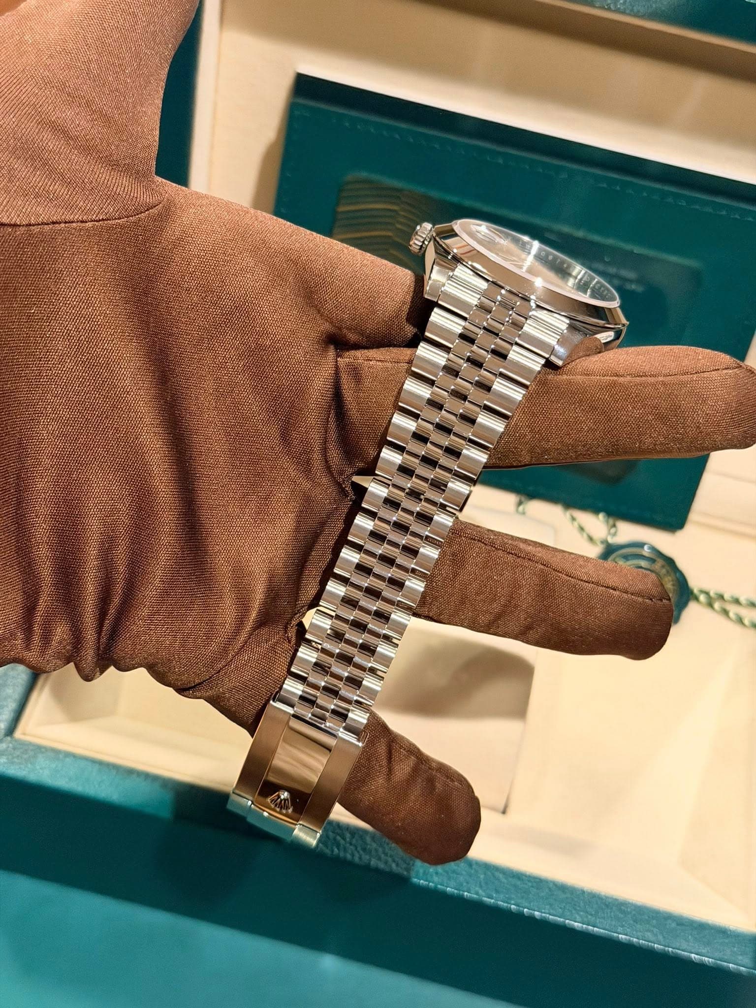 May be an image of wrist watch and text