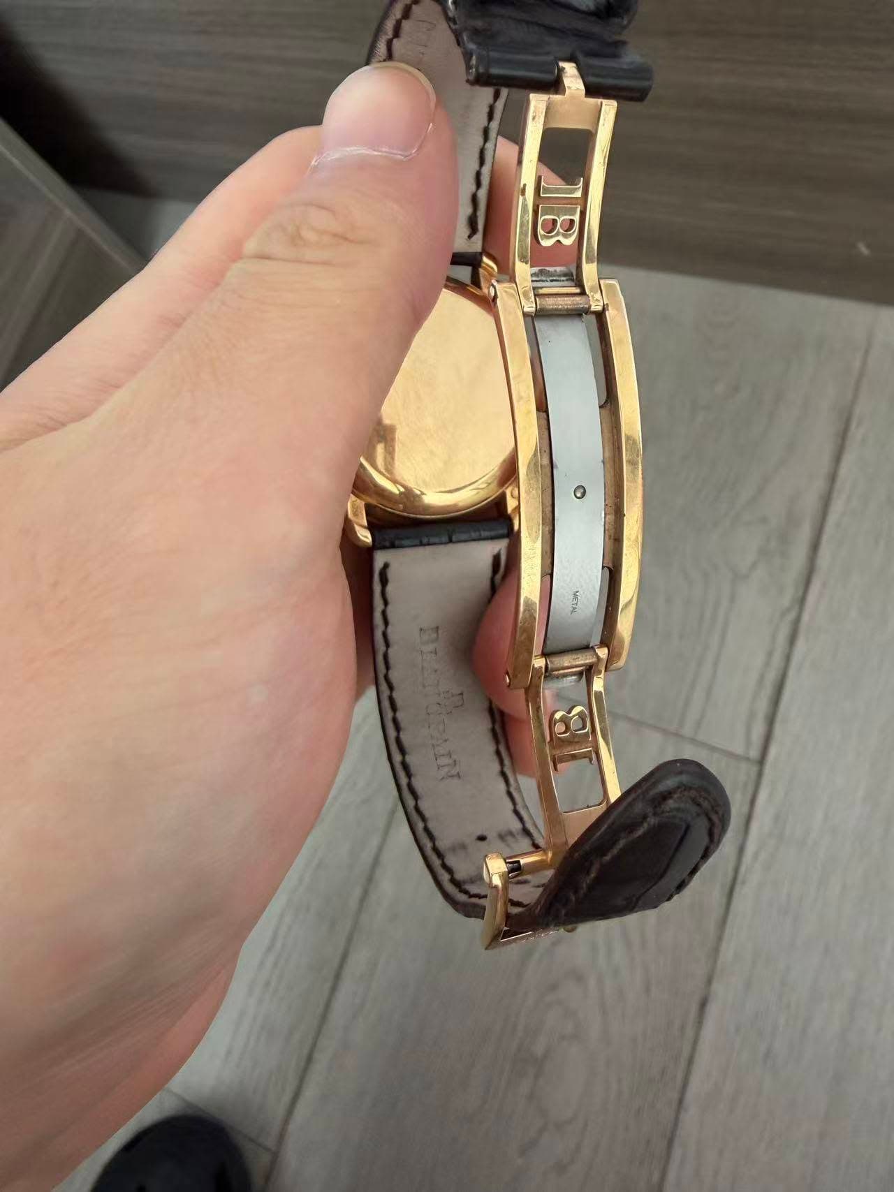 May be an image of digital watch and leather