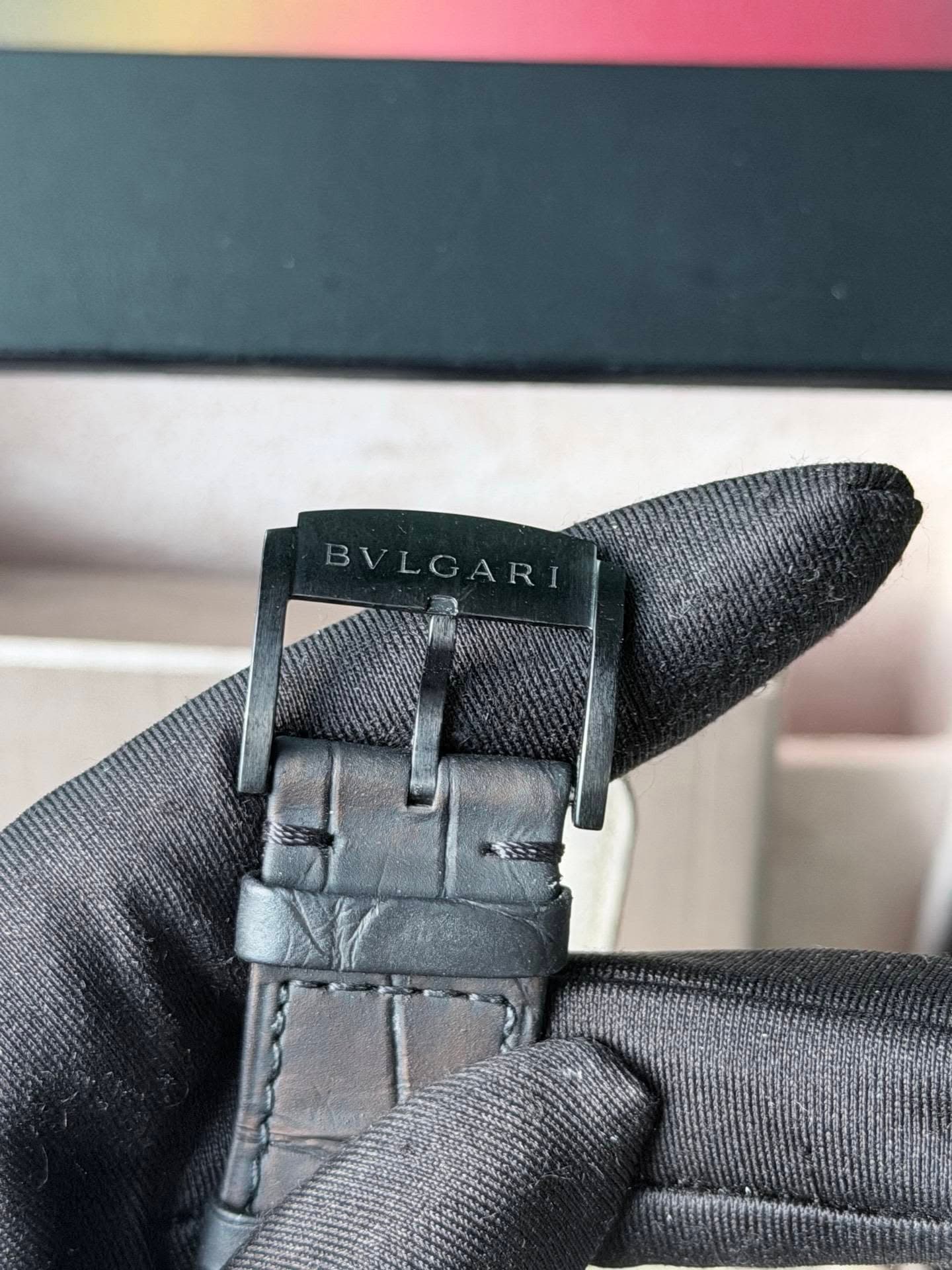 May be an image of digital watch, leather and text that says 'BVLGARI BV'