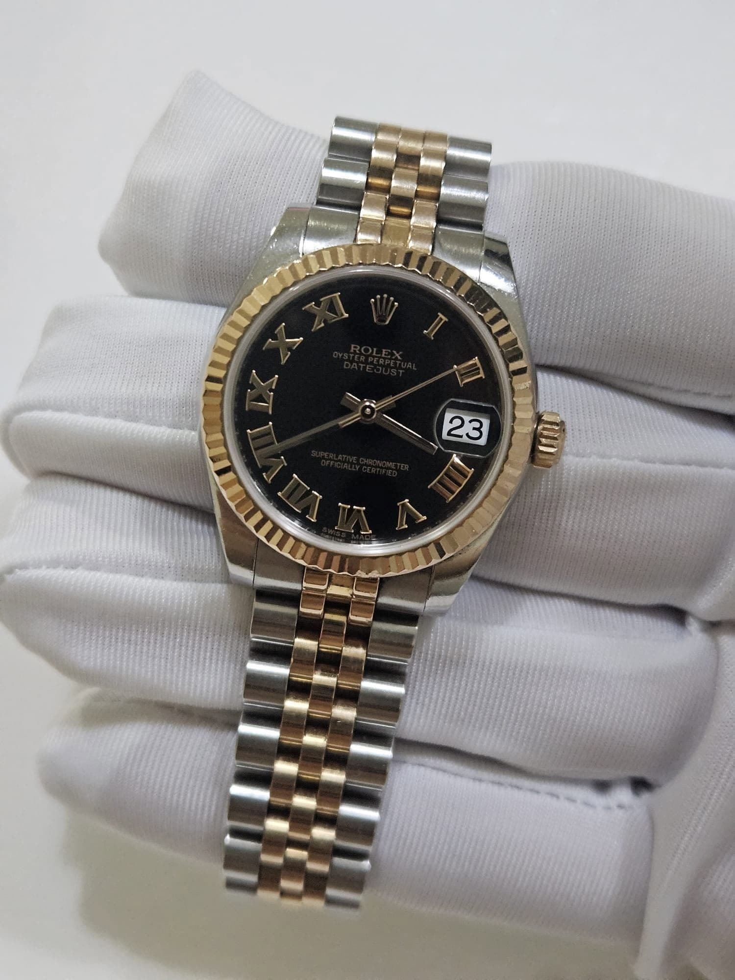 May be an image of wrist watch and text