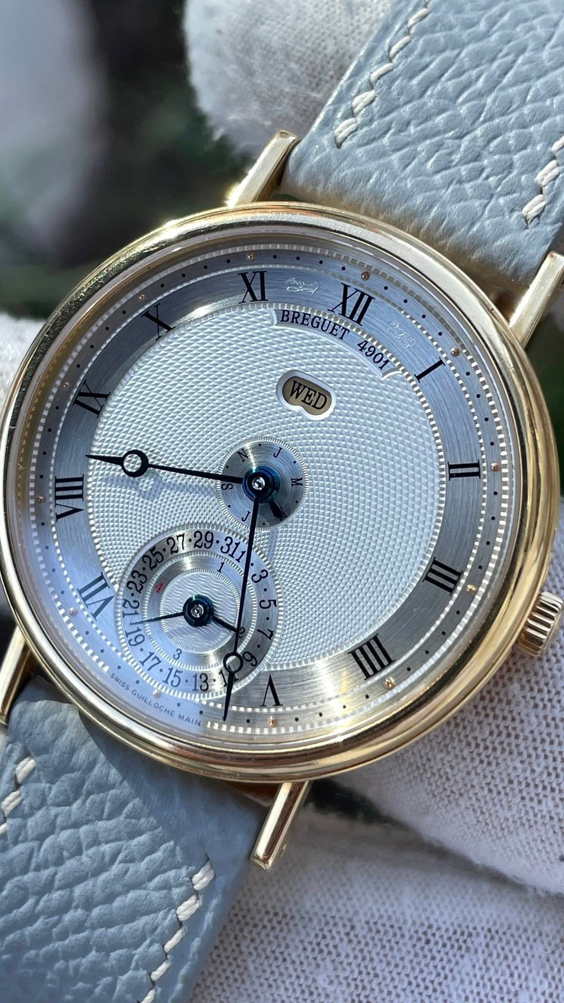 May be an image of wrist watch and text