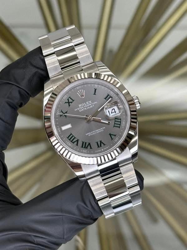 May be an image of wrist watch and text