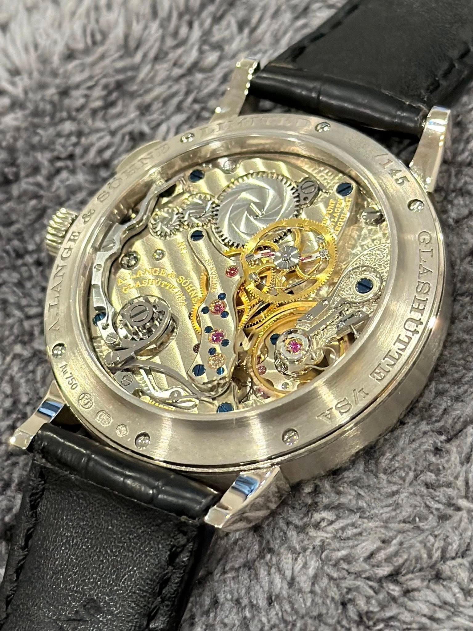 May be an image of wrist watch and text