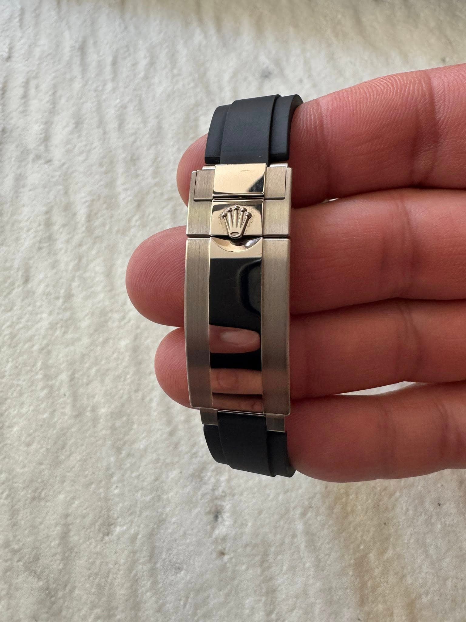 May be an image of wrist watch and text